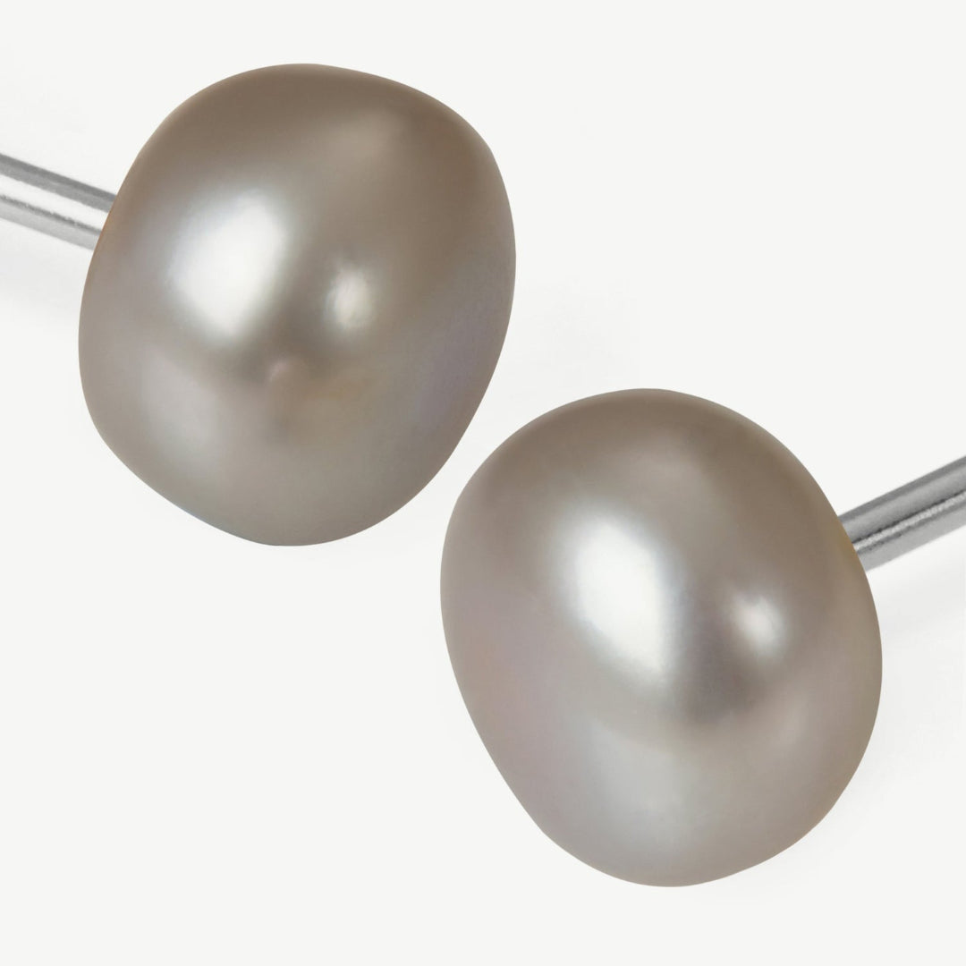Pair of pearl earrings on a white background