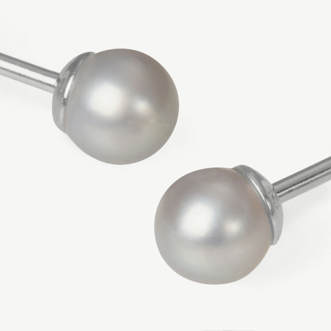 Pair of pearl earrings on a white background