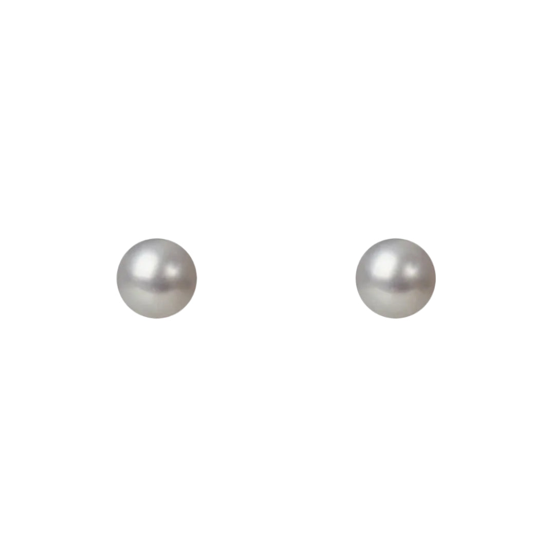 Two pearl earrings on a white background