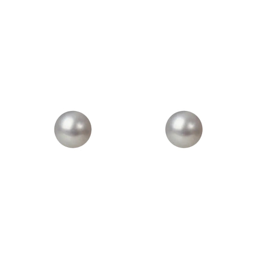 Two pearl earrings on a white background
