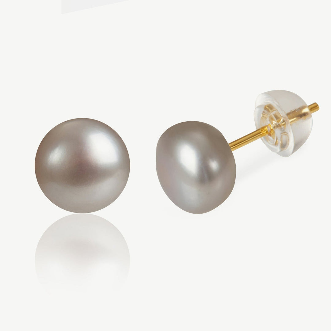 Pearl earrings with gold posts on a white background