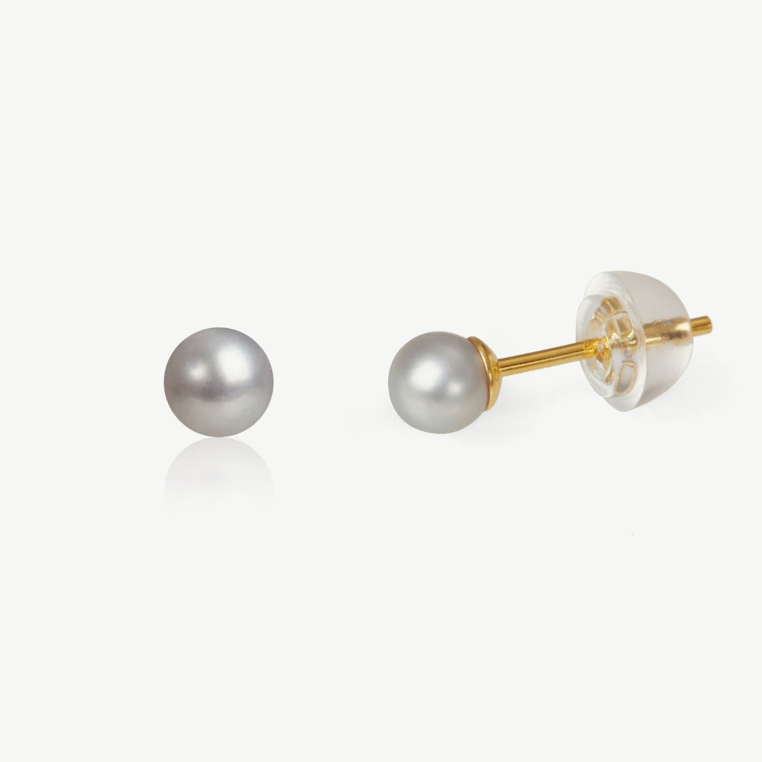 Pearl stud earrings with gold posts on a white background