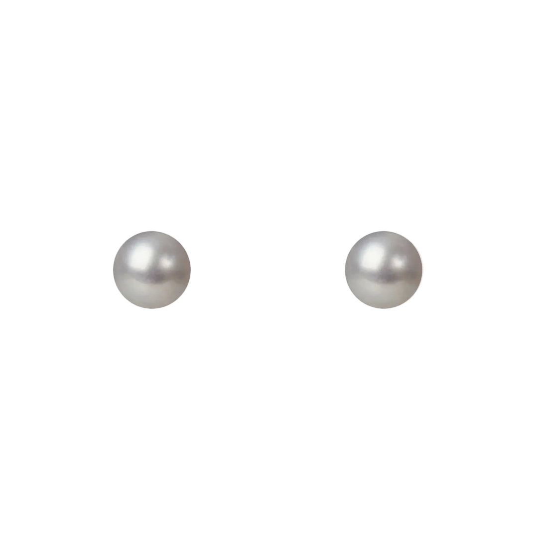 Two pearl earrings on a white background