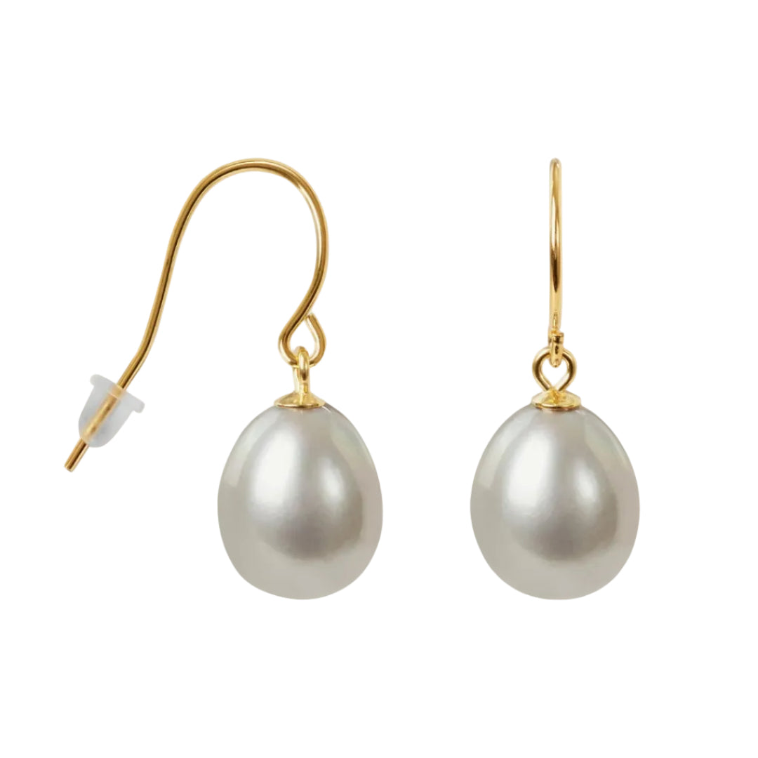 Pearl earrings with gold hooks on a white background