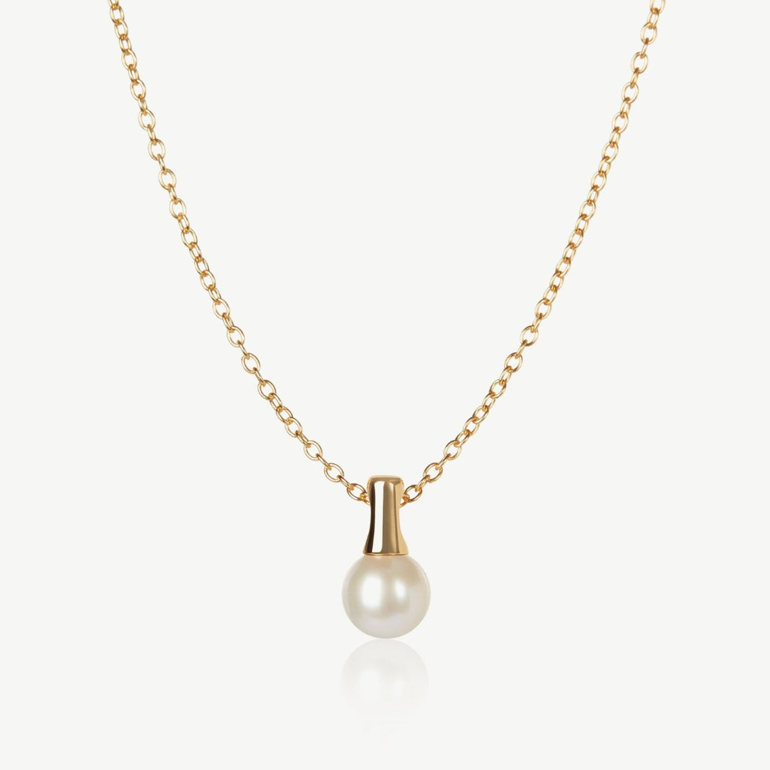 Gold necklace with a pearl pendant on a white background