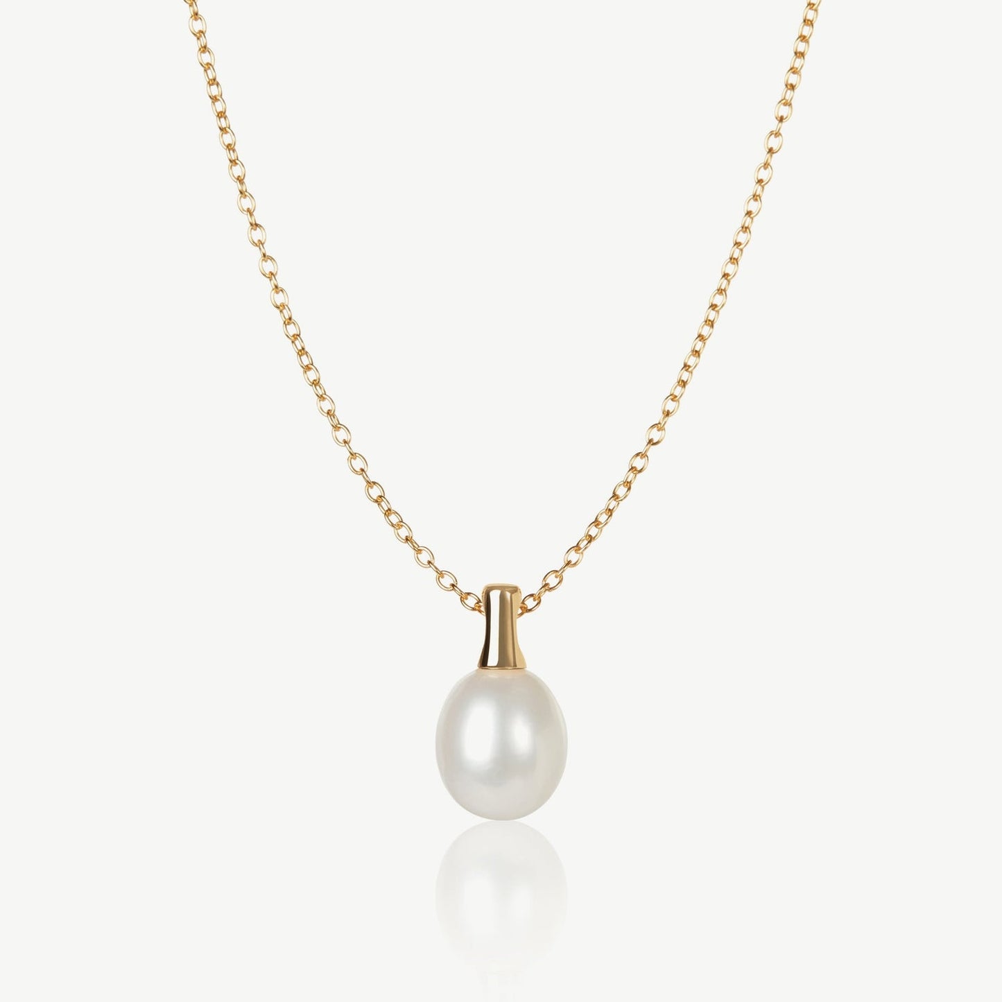Pearl necklace with gold chain on a white background