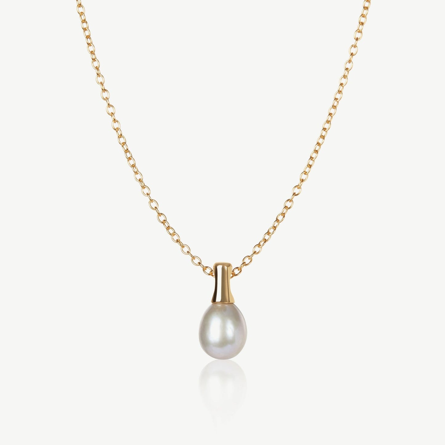 Gold necklace with a pearl pendant on a white background