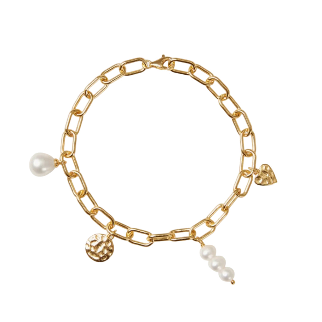 Gold chain bracelet with pearls and charms on a white background