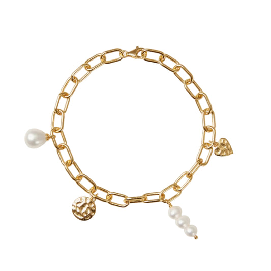 Gold chain bracelet with pearls and charms on a white background