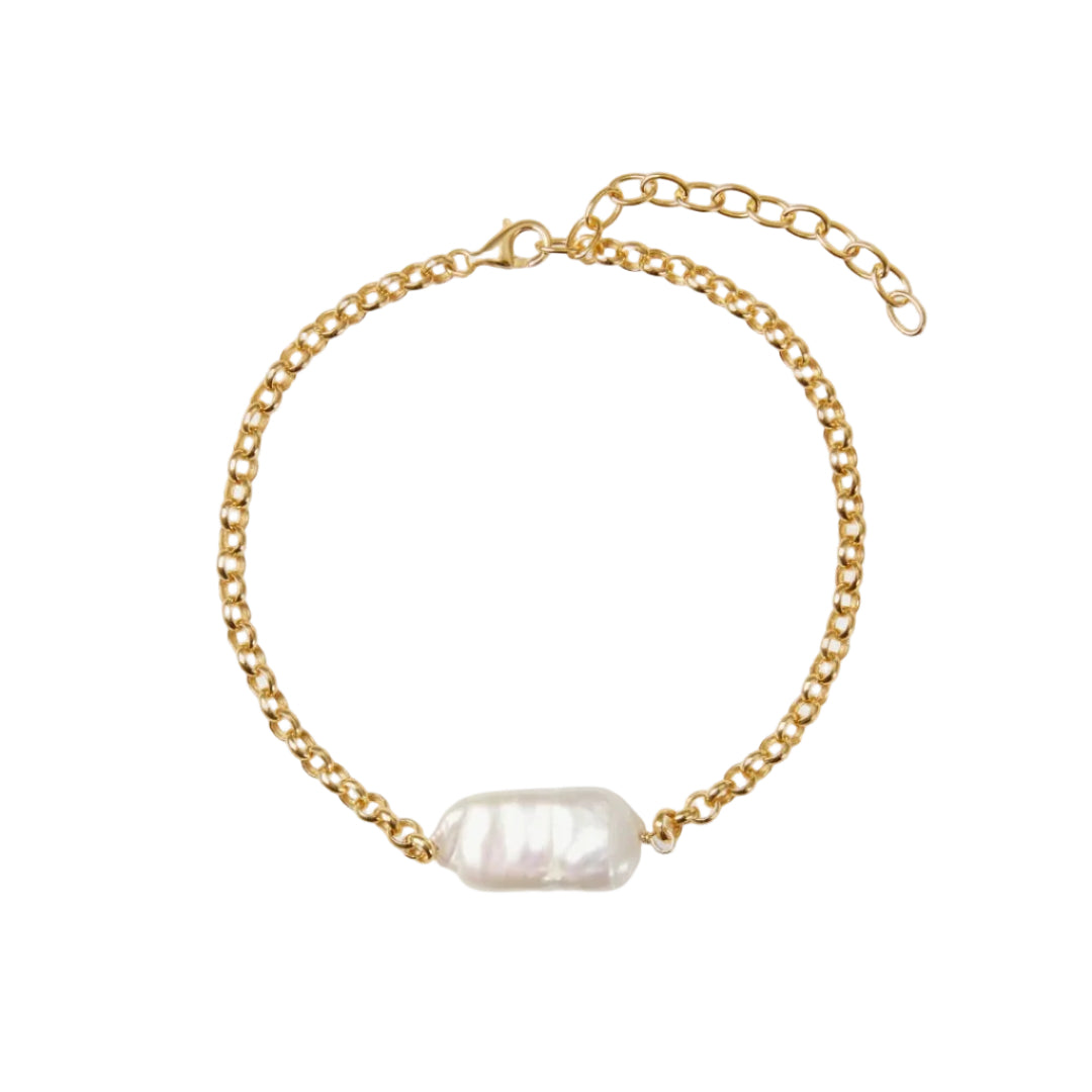 Gold chain bracelet with a single pearl on a white background