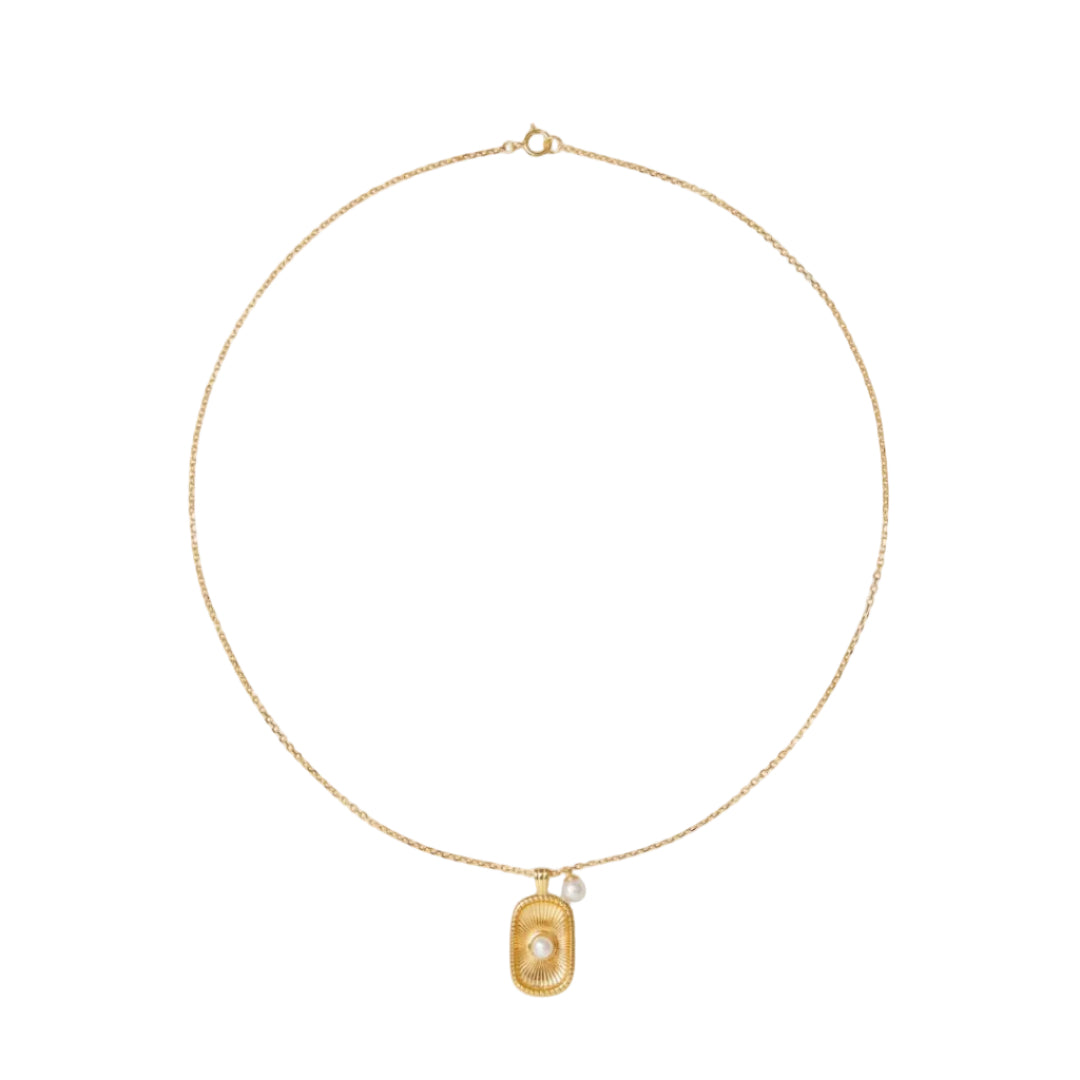 Gold necklace with a pendant on a white background