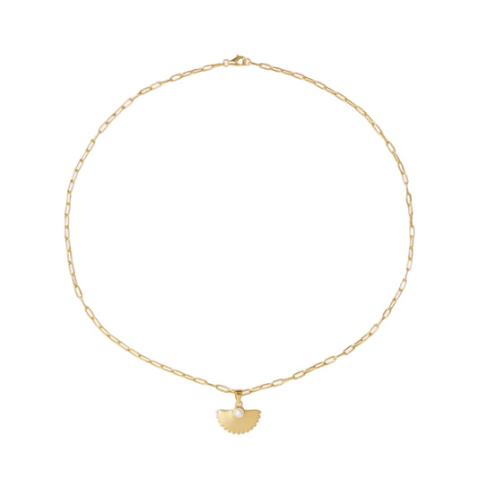 Gold necklace with a heart-shaped pendant on a white background