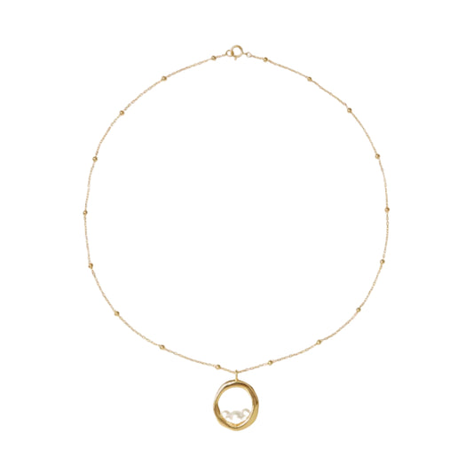 Gold necklace with a pendant on a white background