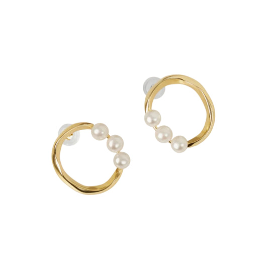 Gold hoop earrings with pearls on a white background