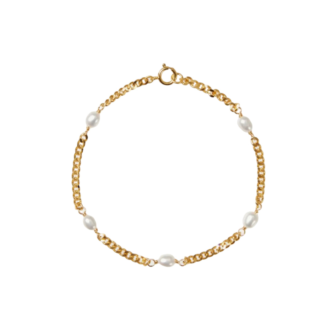 Gold chain bracelet with pearls on a white background